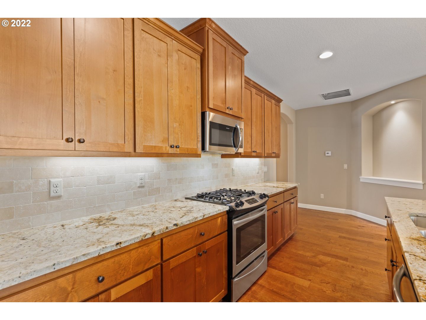 1719 Northeast 175th Street Ridgefield, WA 98642 - Photo 13 of 32 a kitchen with granite countertop cabinets stainless steel appliances and a counter space