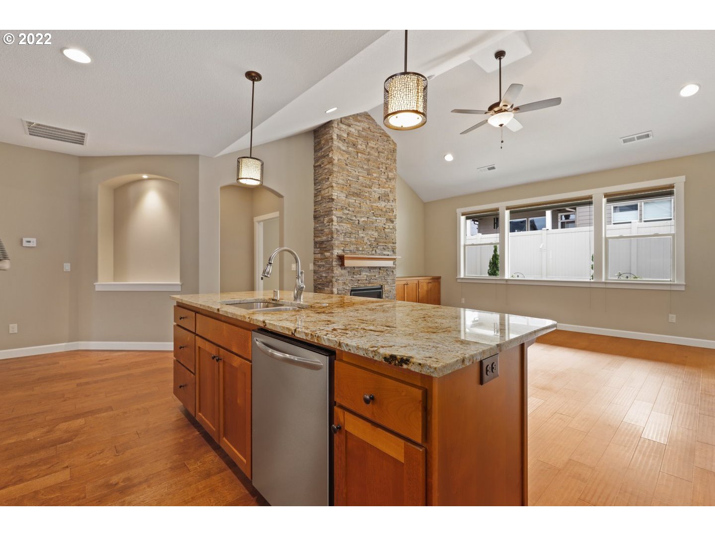 1719 Northeast 175th Street Ridgefield, WA 98642 - Photo 14 of 32 a kitchen with center island and wooden floor