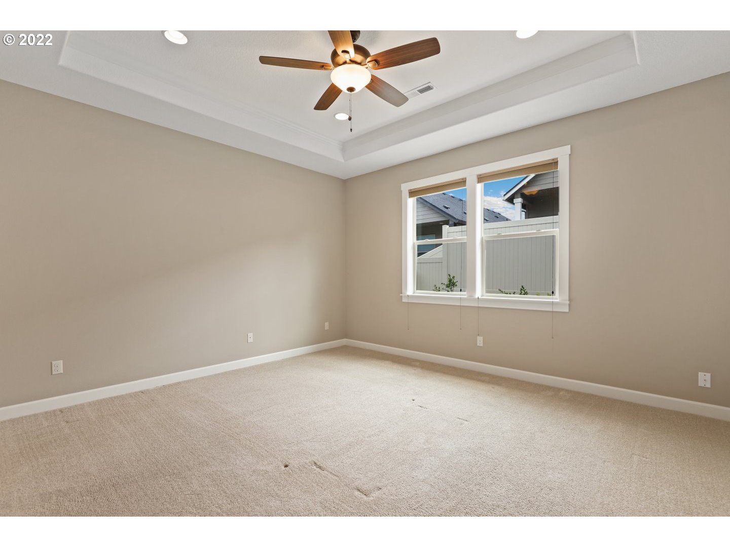 1719 Northeast 175th Street Ridgefield, WA 98642 - Photo 18 of 32 an empty room with windows and ceiling fan