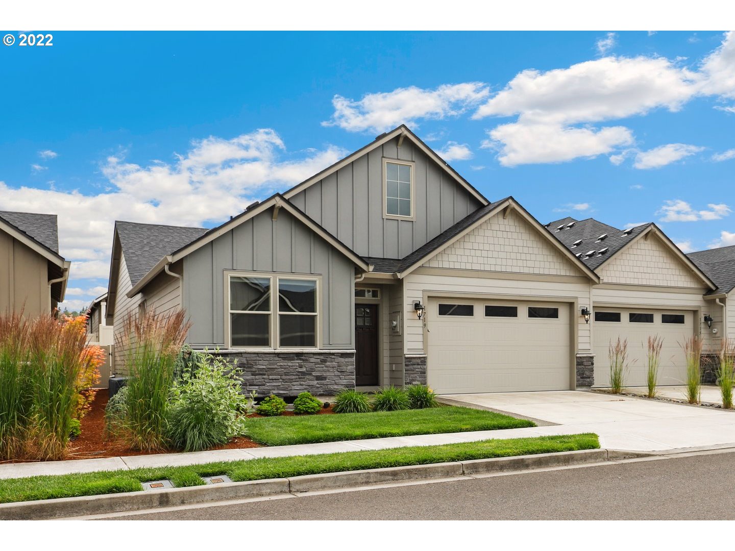 1719 Northeast 175th Street Ridgefield, WA 98642 - Photo 2 of 32 a front view of a house with a garden