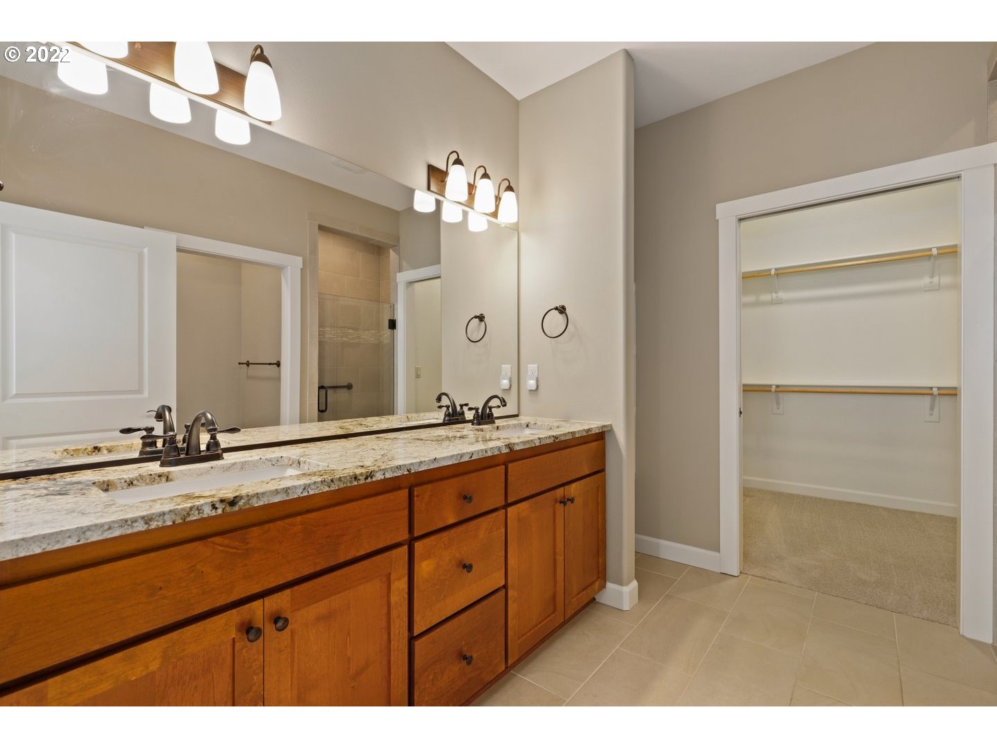 1719 Northeast 175th Street Ridgefield, WA 98642 - Photo 22 of 32 a bathroom with a double vanity sink and a mirror