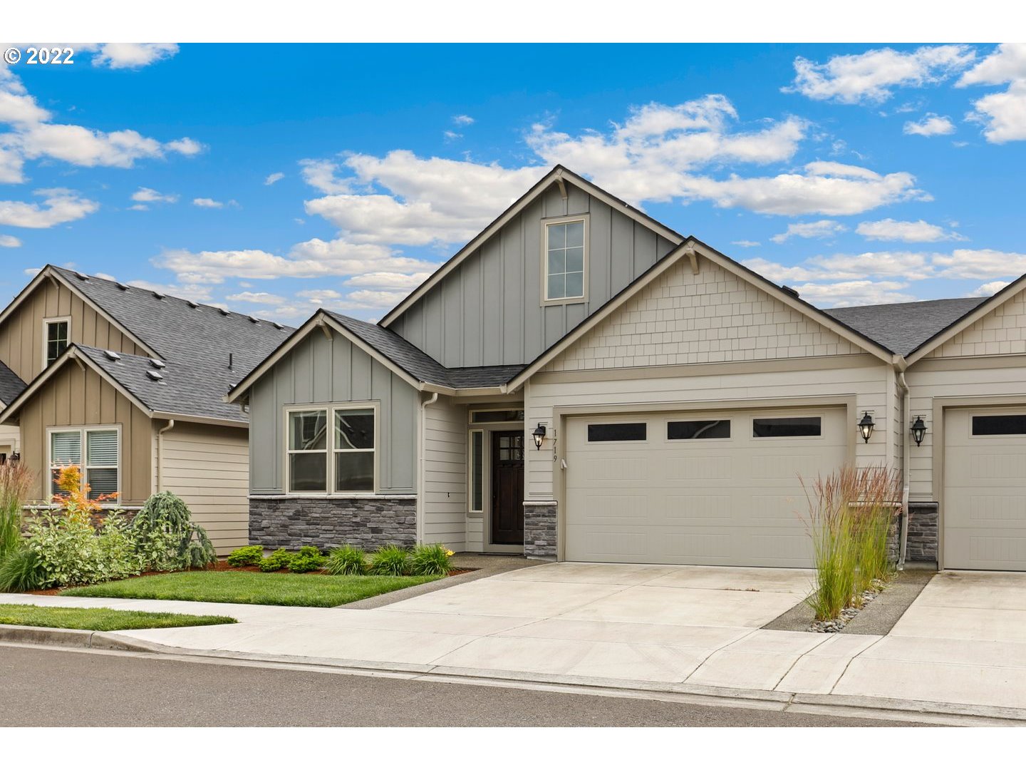 1719 Northeast 175th Street Ridgefield, WA 98642 - Photo 3 of 32 a front view of a house with a yard