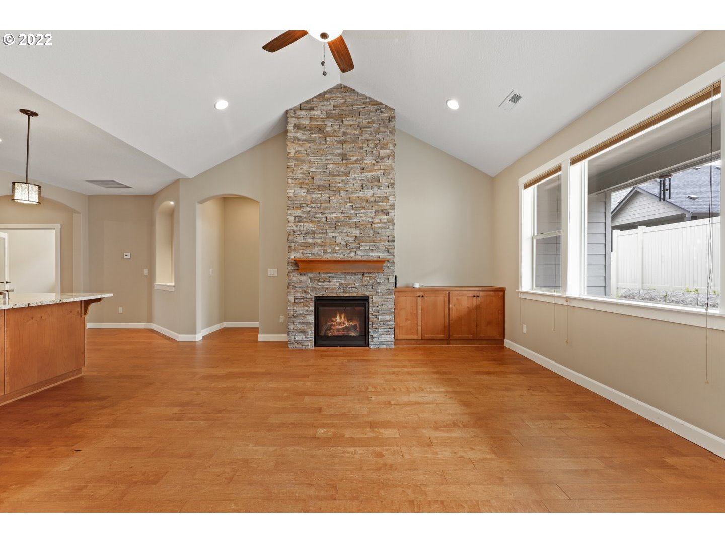 1719 Northeast 175th Street Ridgefield, WA 98642 - Photo 9 of 32 a view of an empty room with a fireplace and a window