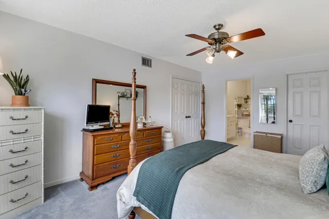 a bedroom with a bed and a television