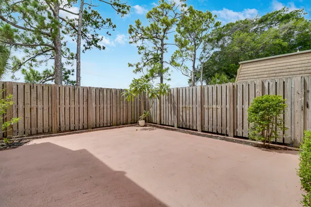 a backyard of a house with wooden floor