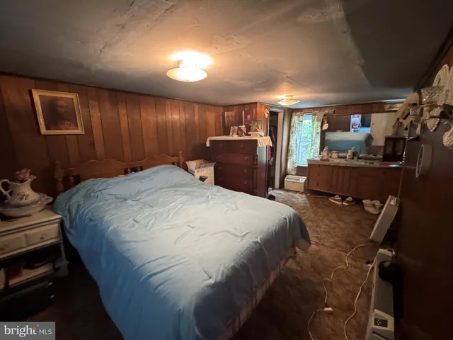 a bed room with a bed and a television