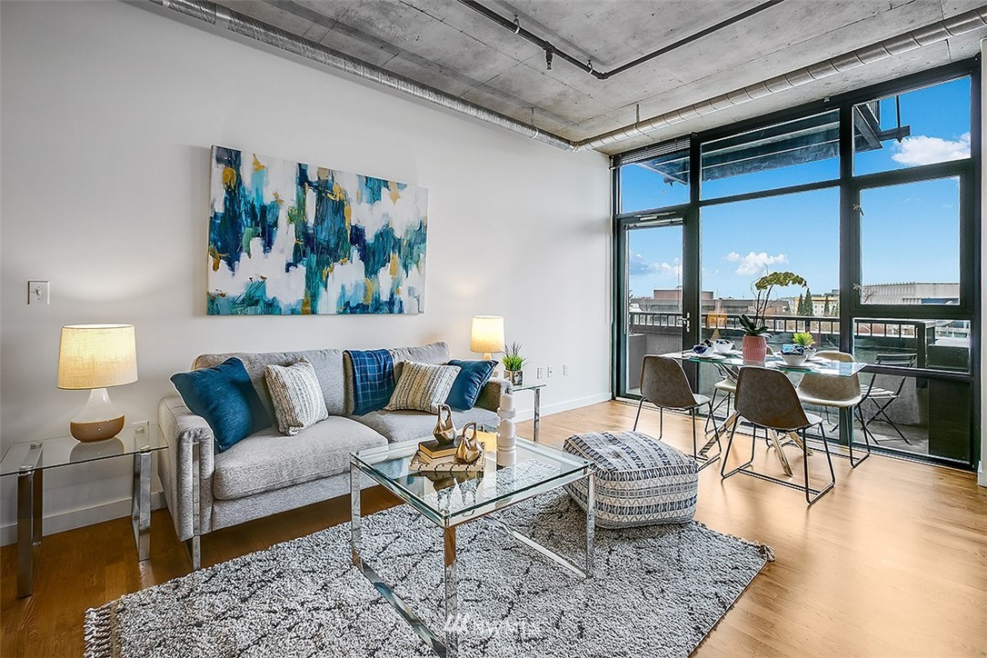 2720 3rd Avenue, Unit 502 Seattle, WA 98121 - Photo 3 of 28 a living room with furniture and a large window