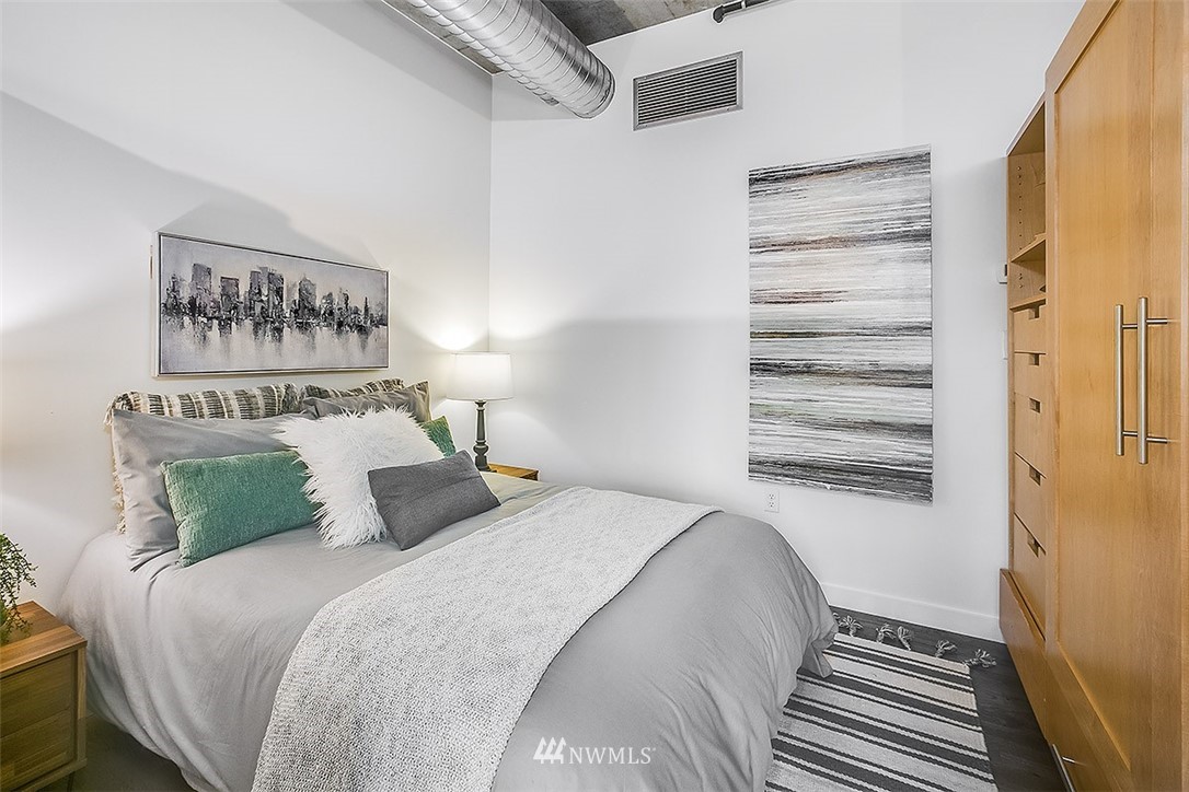 2720 3rd Avenue, Unit 502 Seattle, WA 98121 - Photo 7 of 28 a bedroom with a bed and a window