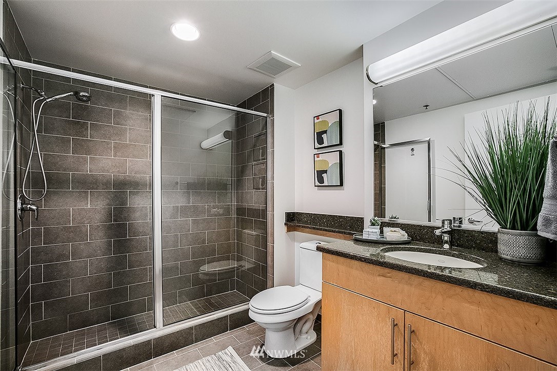 2720 3rd Avenue, Unit 502 Seattle, WA 98121 - Photo 8 of 28 a bathroom with a sink toilet and shower
