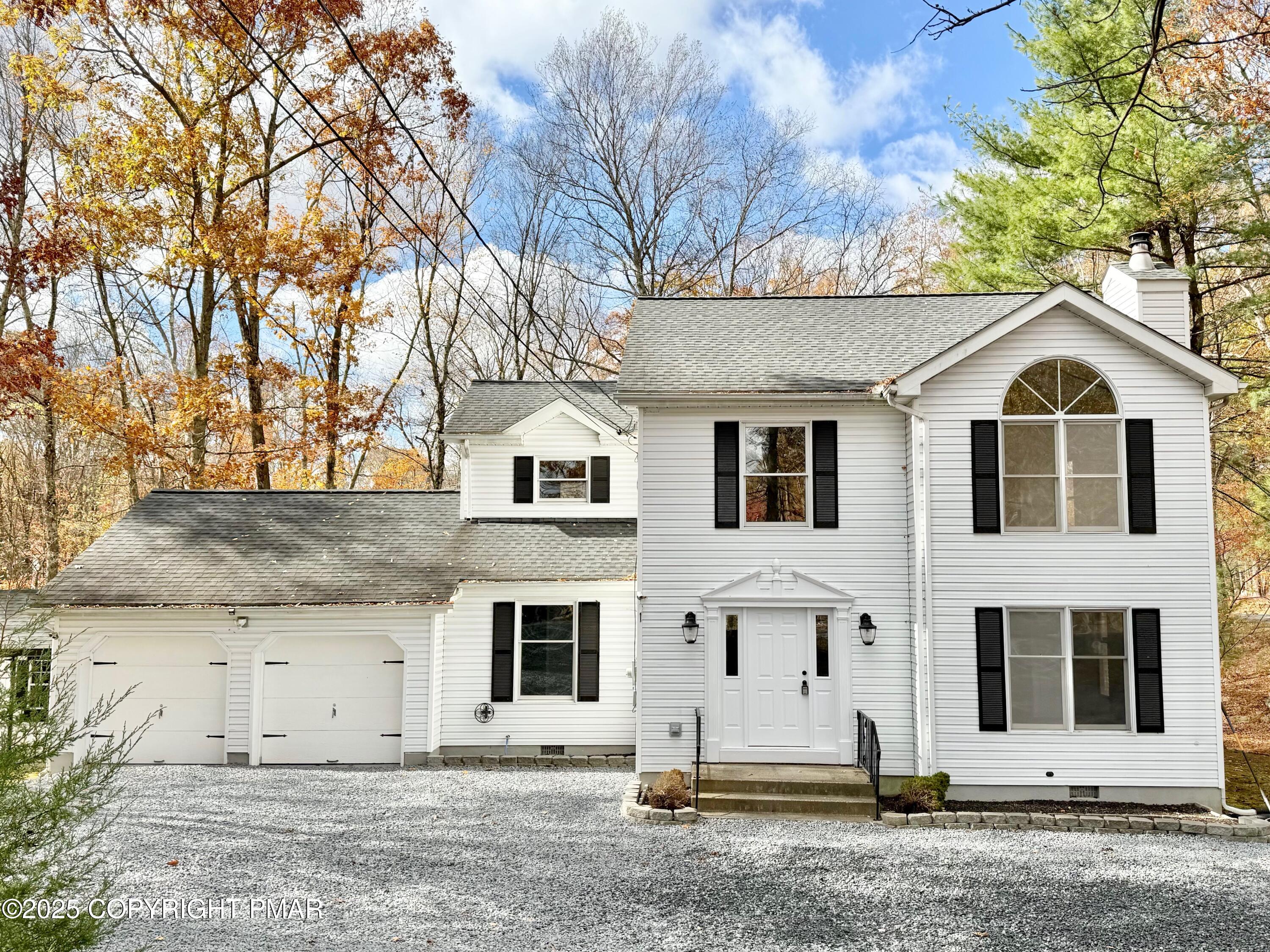 104 Dunchurch Drive Bushkill, PA 18324 - Photo 2 of 35 a view of a white house with a large tree