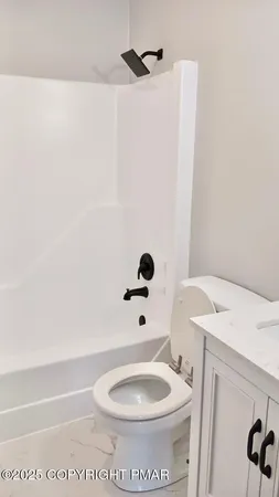 a bathroom with a toilet and a sink