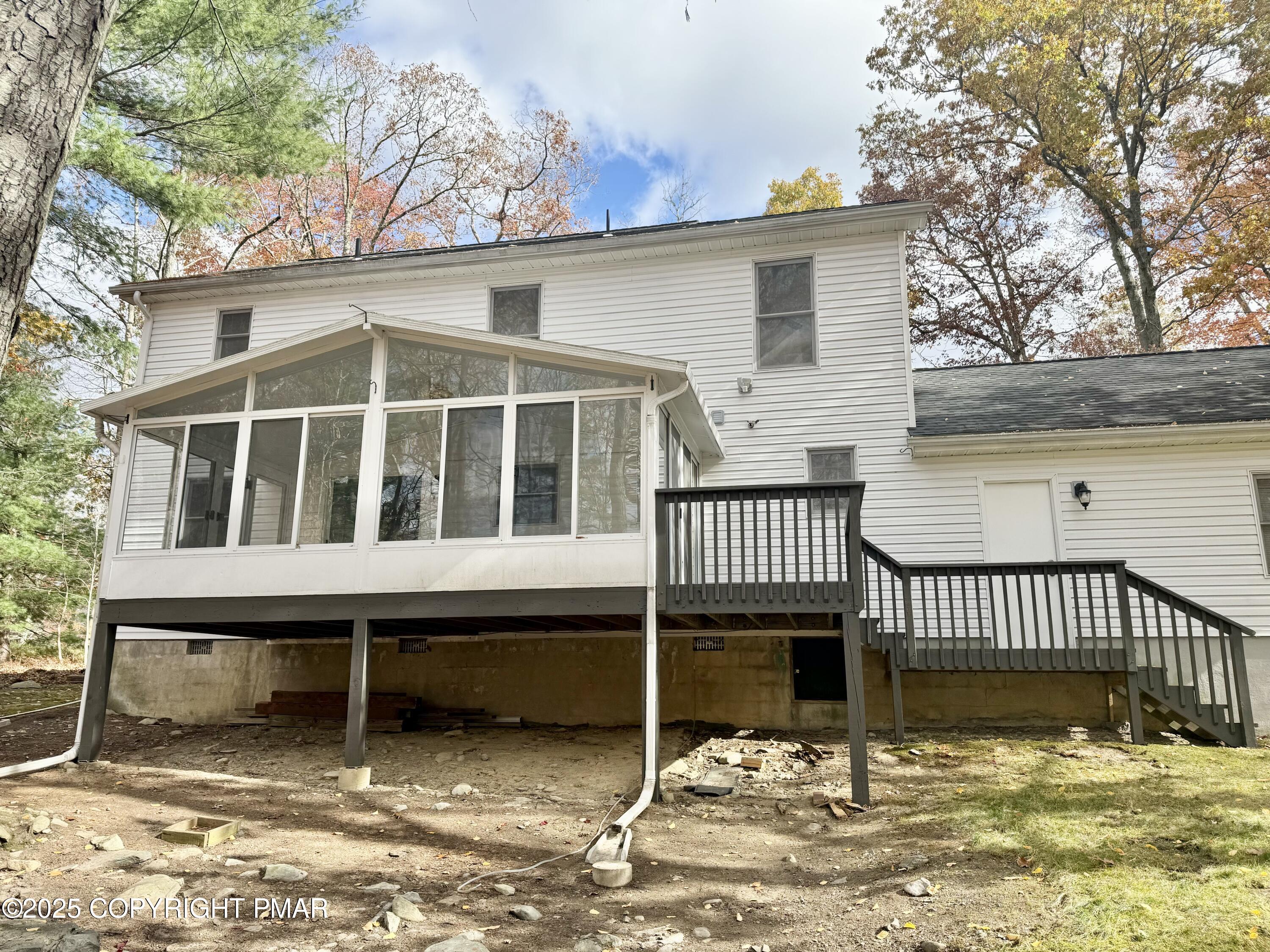 104 Dunchurch Drive Bushkill, PA 18324 - Photo 3 of 35 a view of a house with a wooden deck