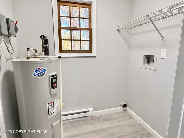 a view of a storage & utility room with a sink