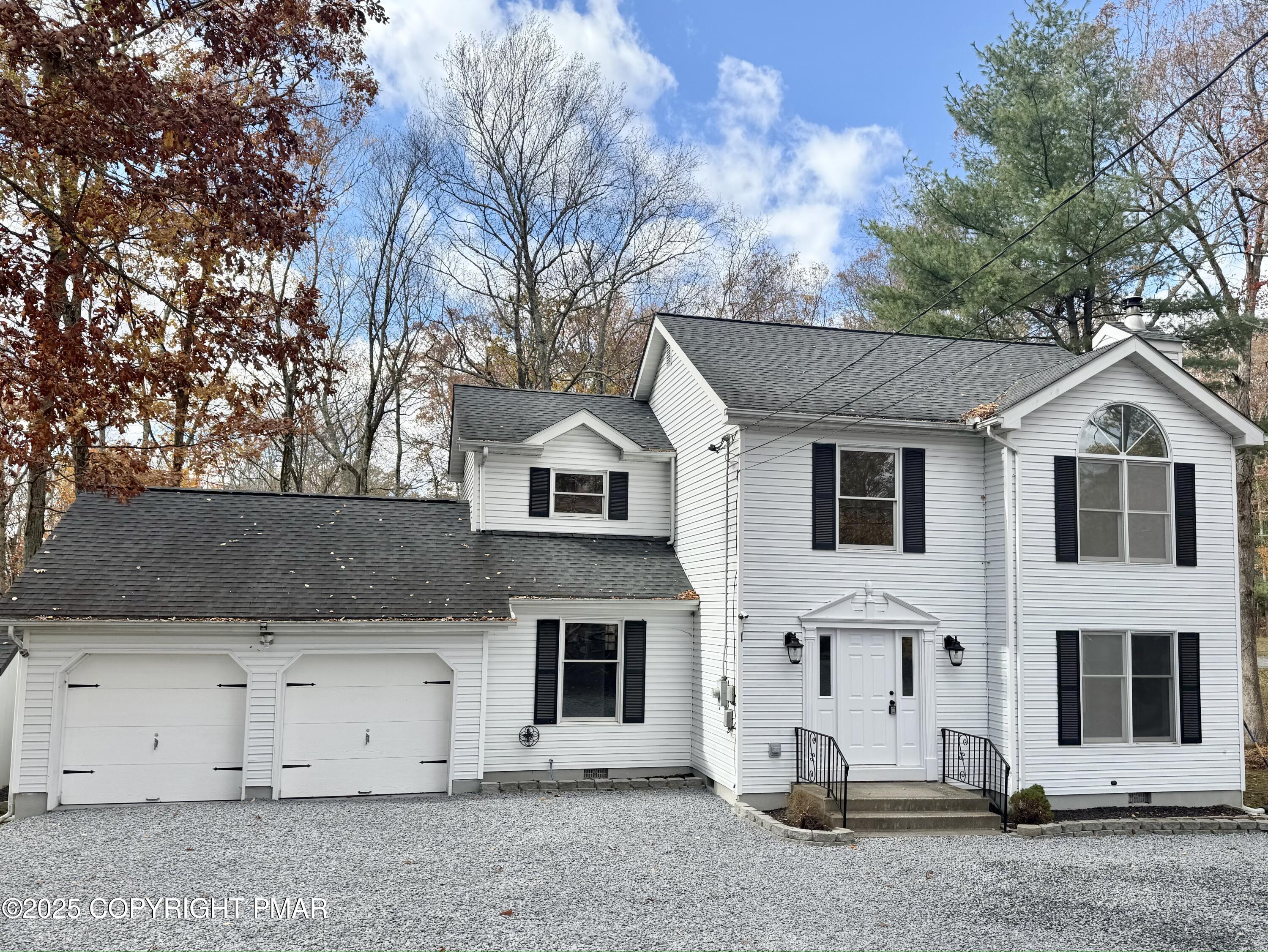 104 Dunchurch Drive Bushkill, PA 18324 - Photo 35 of 35 a view of a white house with a yard and garage