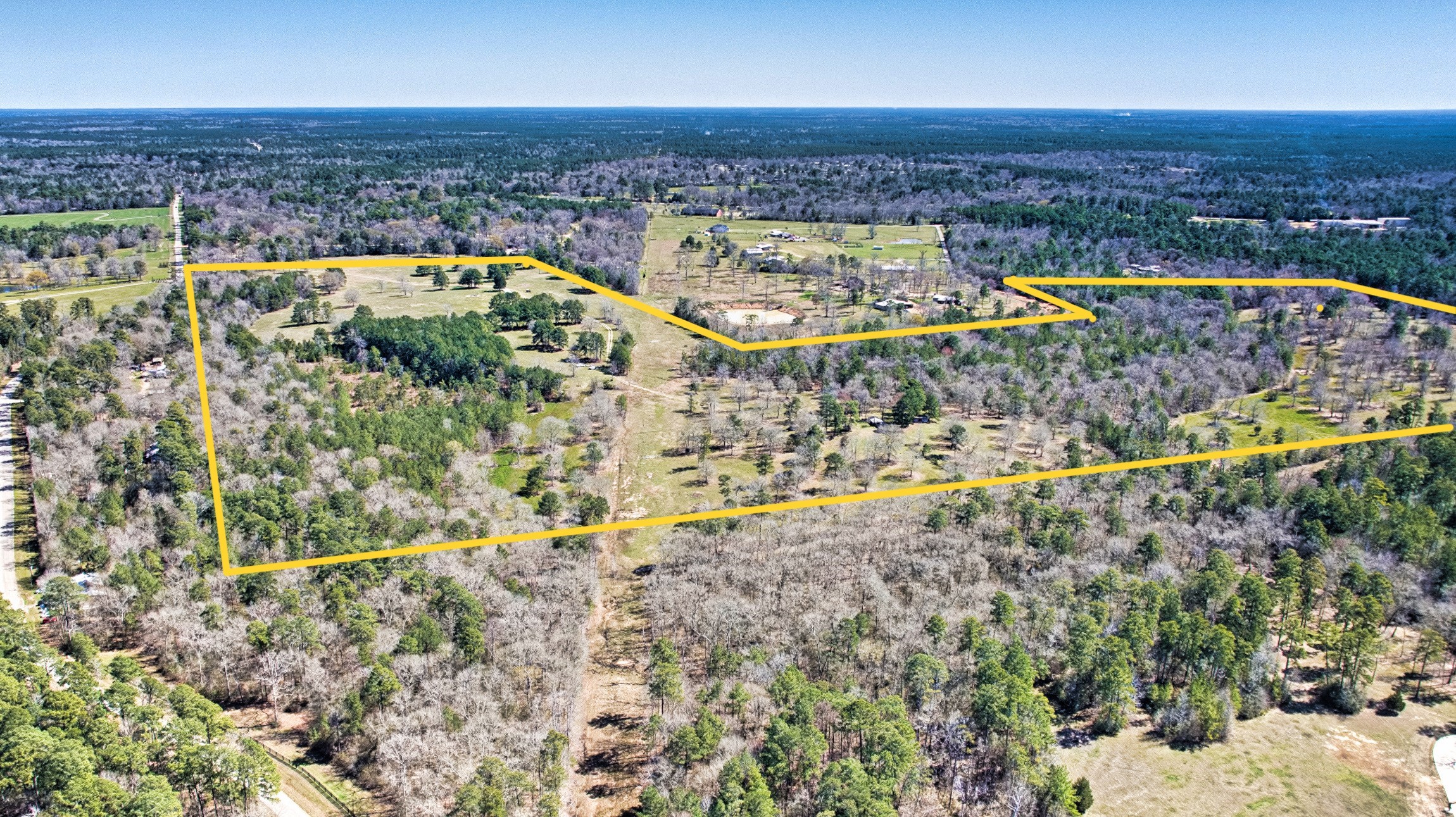 10994 Bilnoski Road Willis, TX 77378 - Photo 1 of 21 an aerial view of residential houses with outdoor space