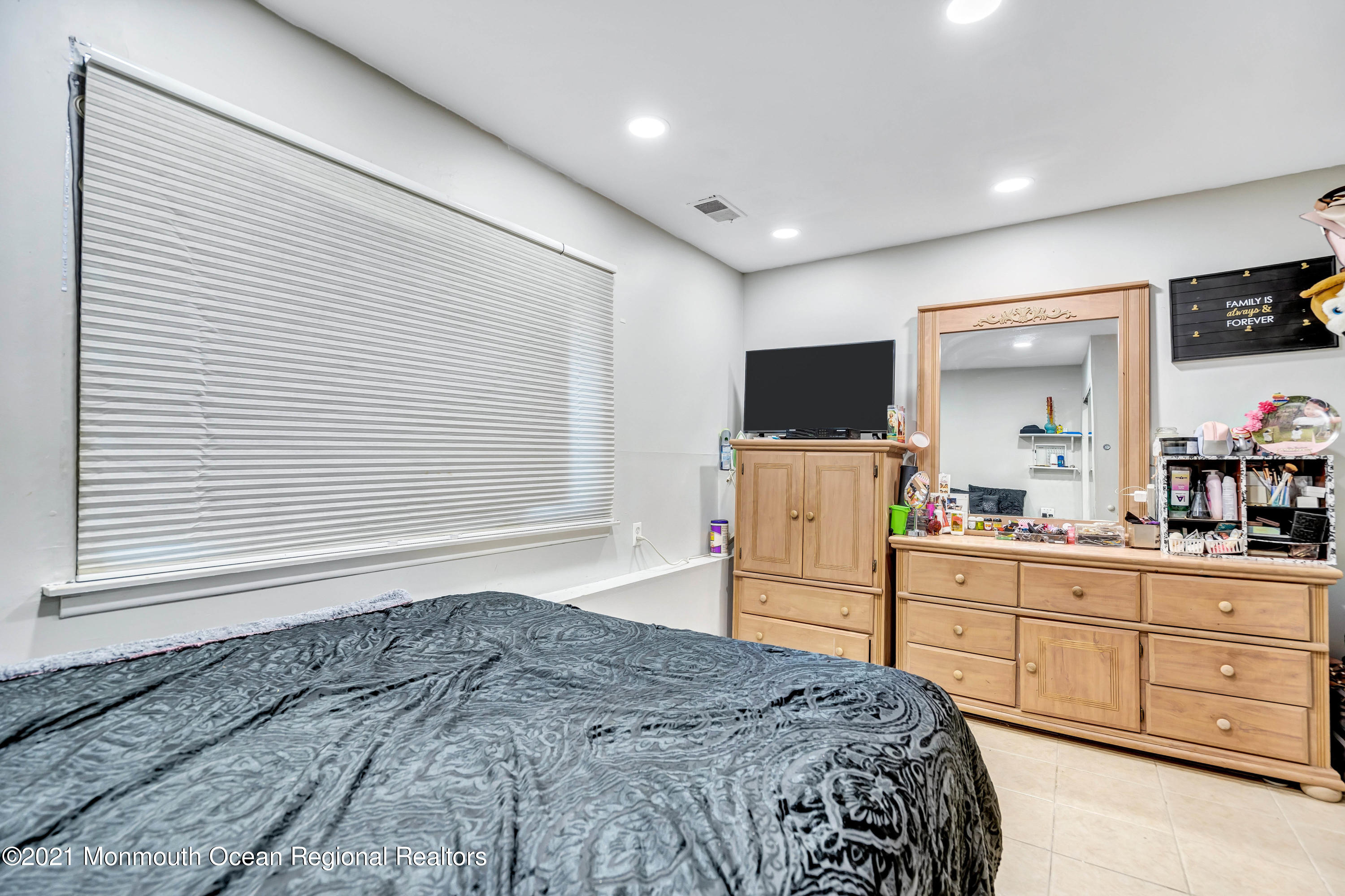 458 Brewers Bridge Road Jackson, NJ 08527 - Photo 24 of 27 a bedroom with a bed and a flat screen tv