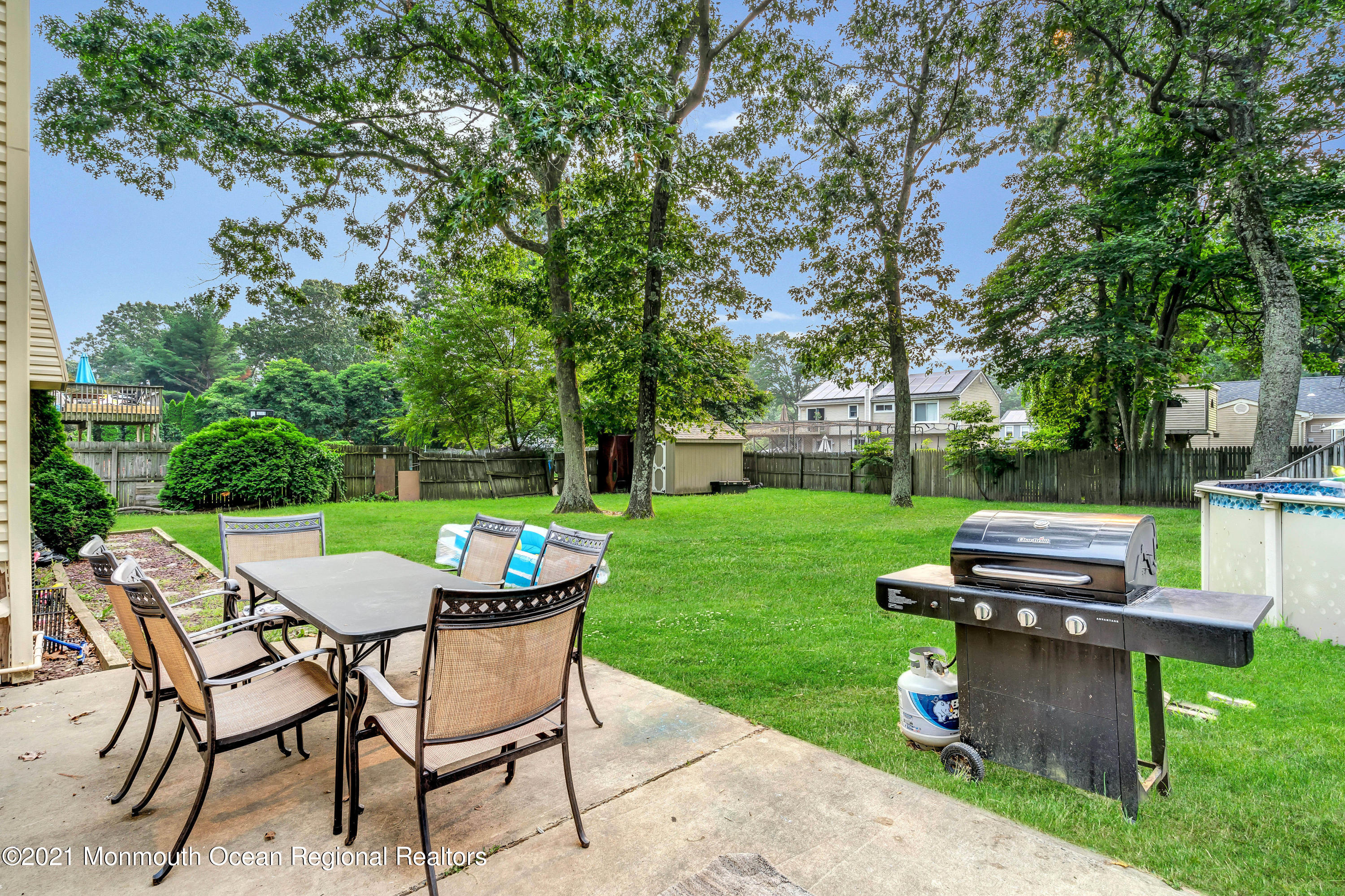 458 Brewers Bridge Road Jackson, NJ 08527 - Photo 25 of 27 a view of a table and chairs in backyard of the house