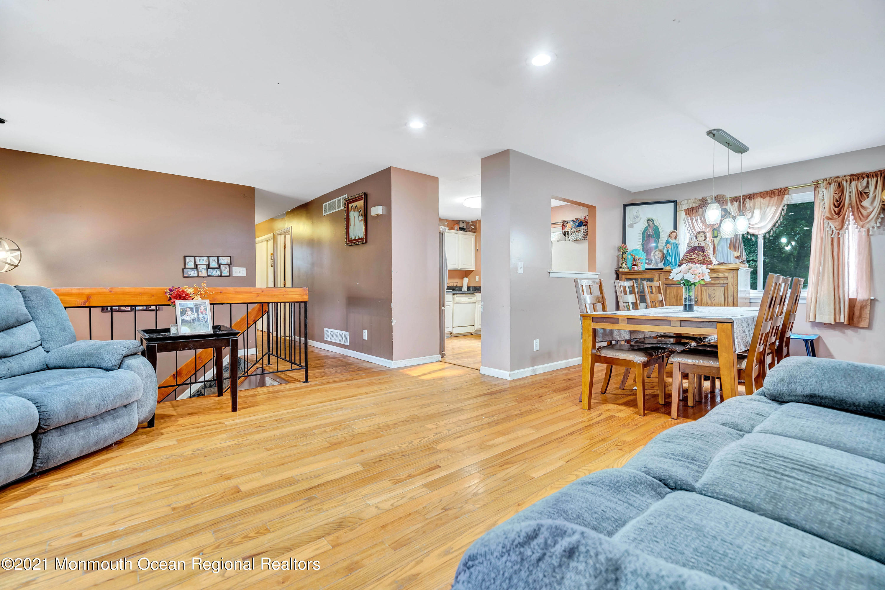 458 Brewers Bridge Road Jackson, NJ 08527 - Photo 10 of 27 a living room with furniture and a dining table with wooden floor