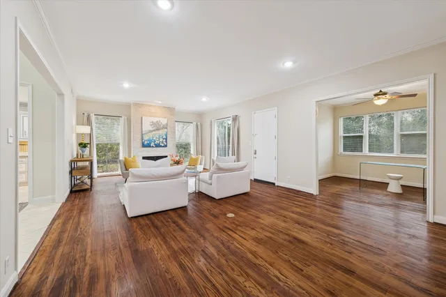 a view of a hallway view with wooden floor and staircase