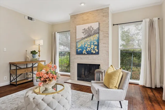a bathroom with a granite countertop sink toilet and mirror