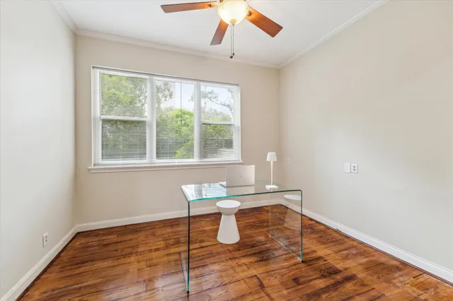 a view of a room with wooden floor