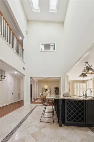 a view of an empty room with a window and a ceiling fan