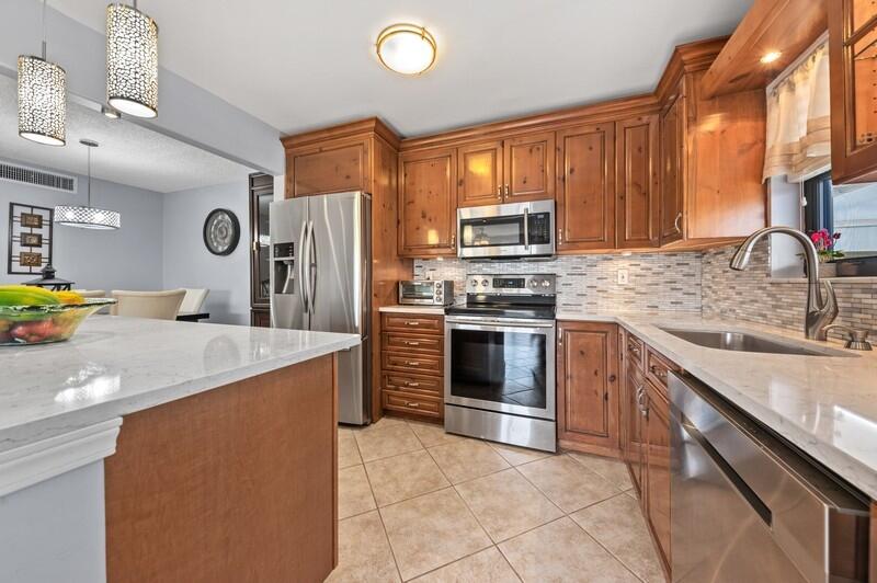 509 Dotterel Road, Unit 23C Delray Beach, FL 33444 - Photo 4 of 15 05_509DotterelRd_Apt23C_177002_Kitchen_F