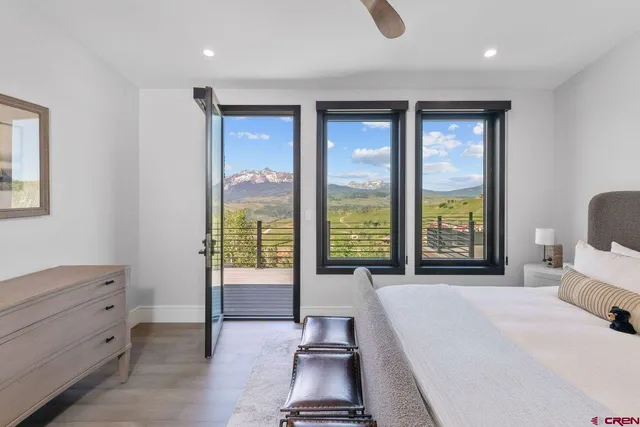 a bed room with a bed and a window