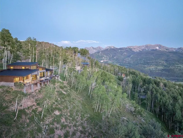 a view of a city with mountains in the background