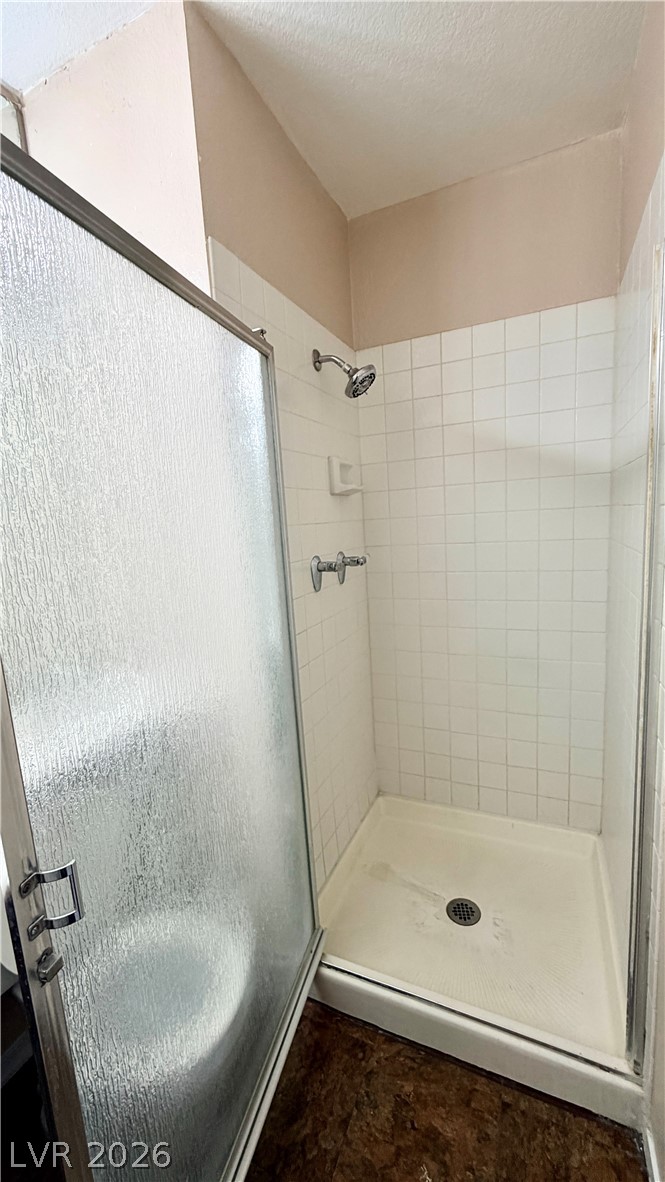 6250 West Flamingo Road, Unit 4 Las Vegas, NV 89103 - Photo 33 of 45 This clean and inviting shower stall features classic tile work and a convenient glass door.