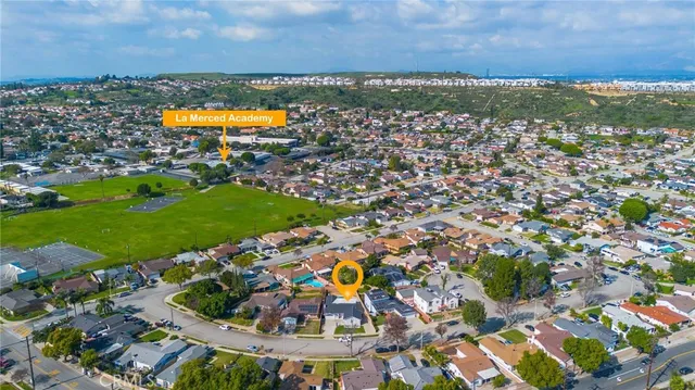 an aerial view of houses with outdoor space