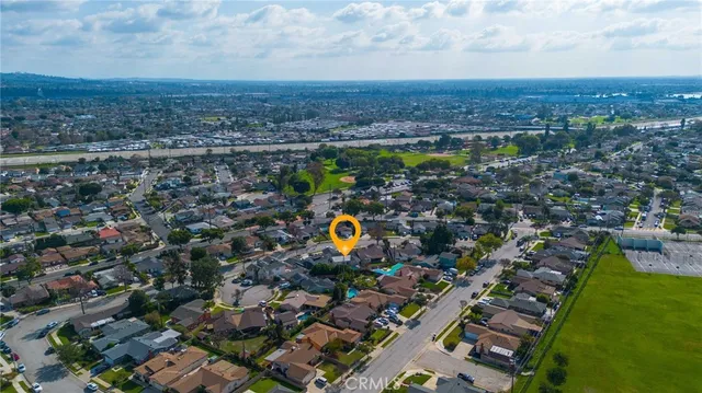 an aerial view of a house with a swimming pool yard and outdoor seating