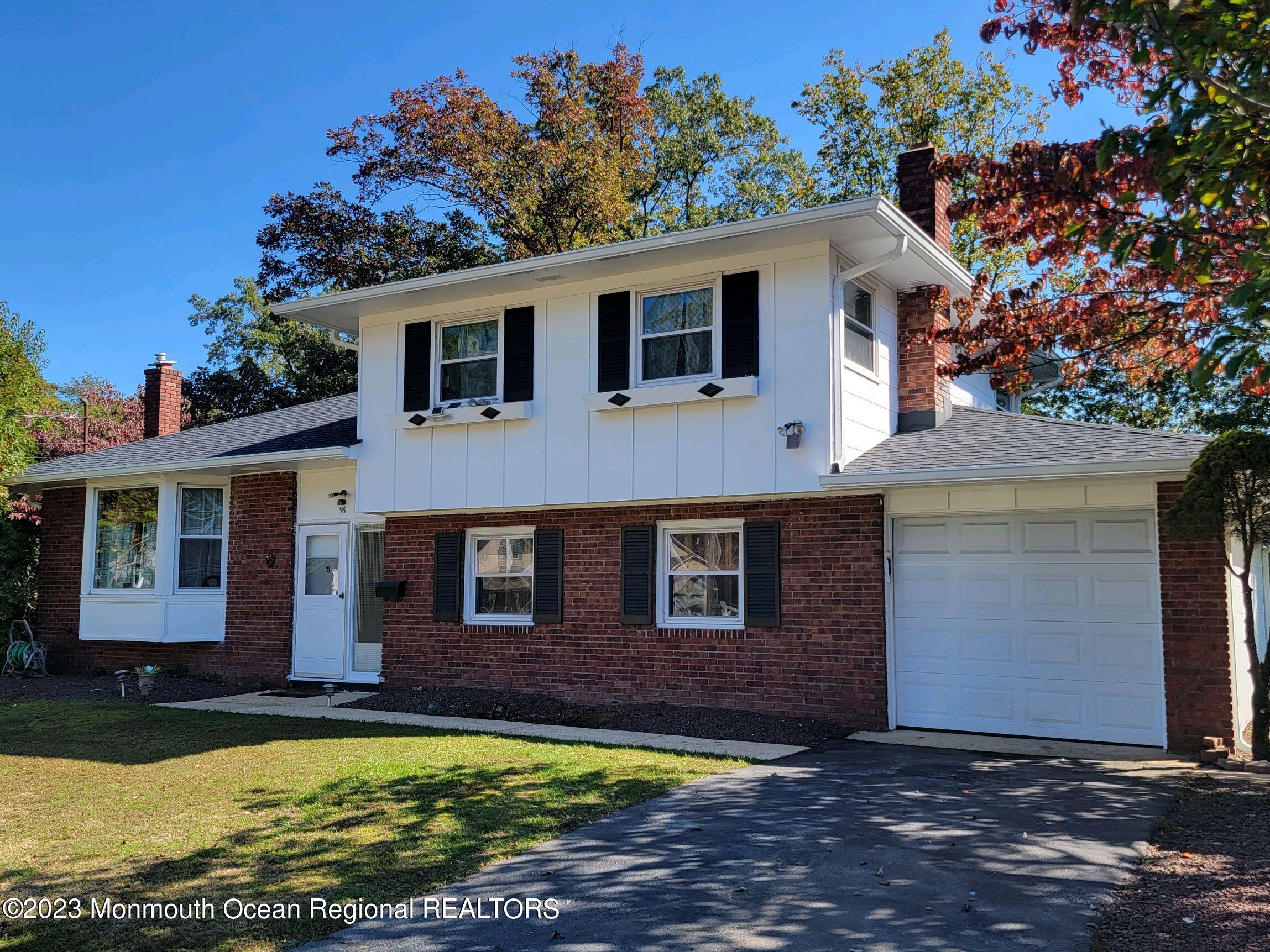96 Newbury Road Howell, NJ 07731 - Photo 1 of 12 front view of a house with a yard