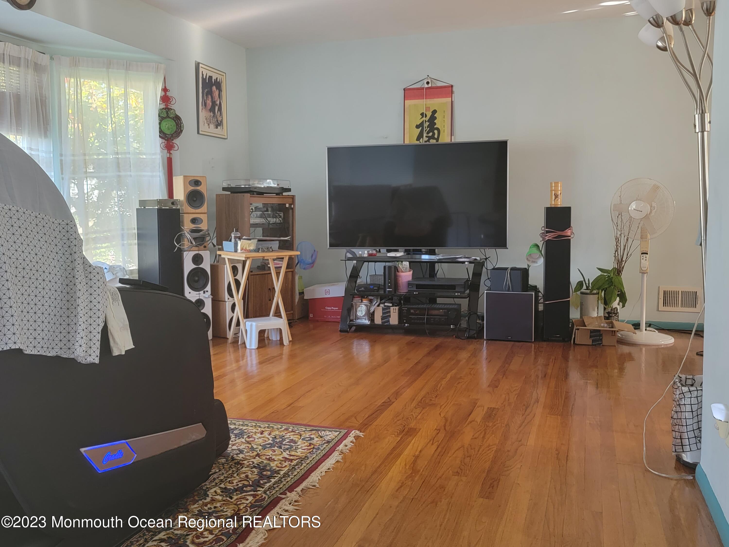 96 Newbury Road Howell, NJ 07731 - Photo 4 of 12 a living room with furniture and a flat screen tv
