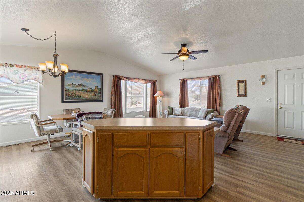 2054 North Thornton Road, Unit 125 Casa Grande, AZ 85122 - Photo 11 of 26 a view of a dining room with furniture window and wooden floor