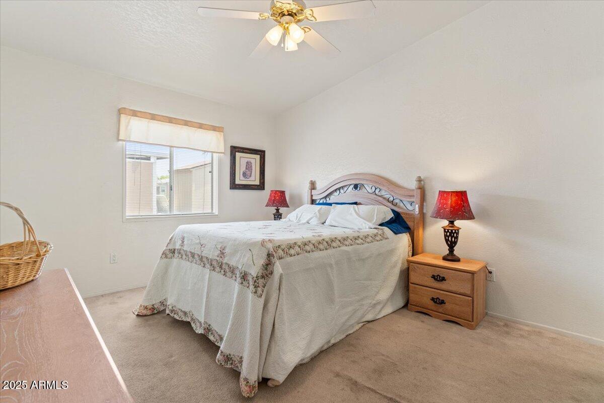 2054 North Thornton Road, Unit 125 Casa Grande, AZ 85122 - Photo 12 of 26 a bedroom with a bed and a window