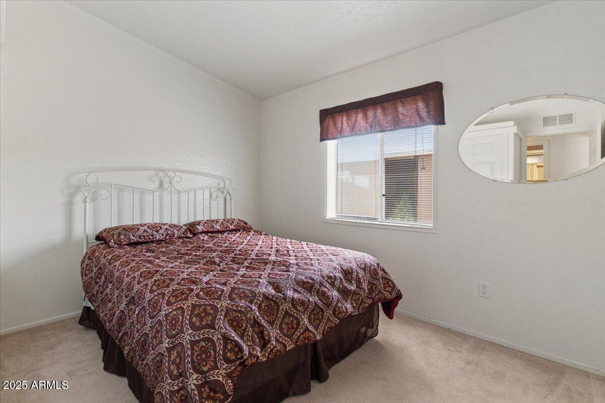 2054 North Thornton Road, Unit 125 Casa Grande, AZ 85122 - Photo 15 of 26 a bedroom with a bed and a window