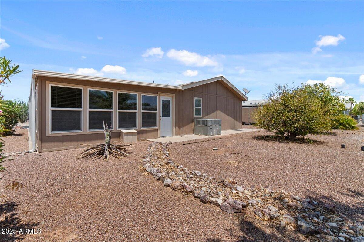 2054 North Thornton Road, Unit 125 Casa Grande, AZ 85122 - Photo 20 of 26 a front view of a house with a yard and garage