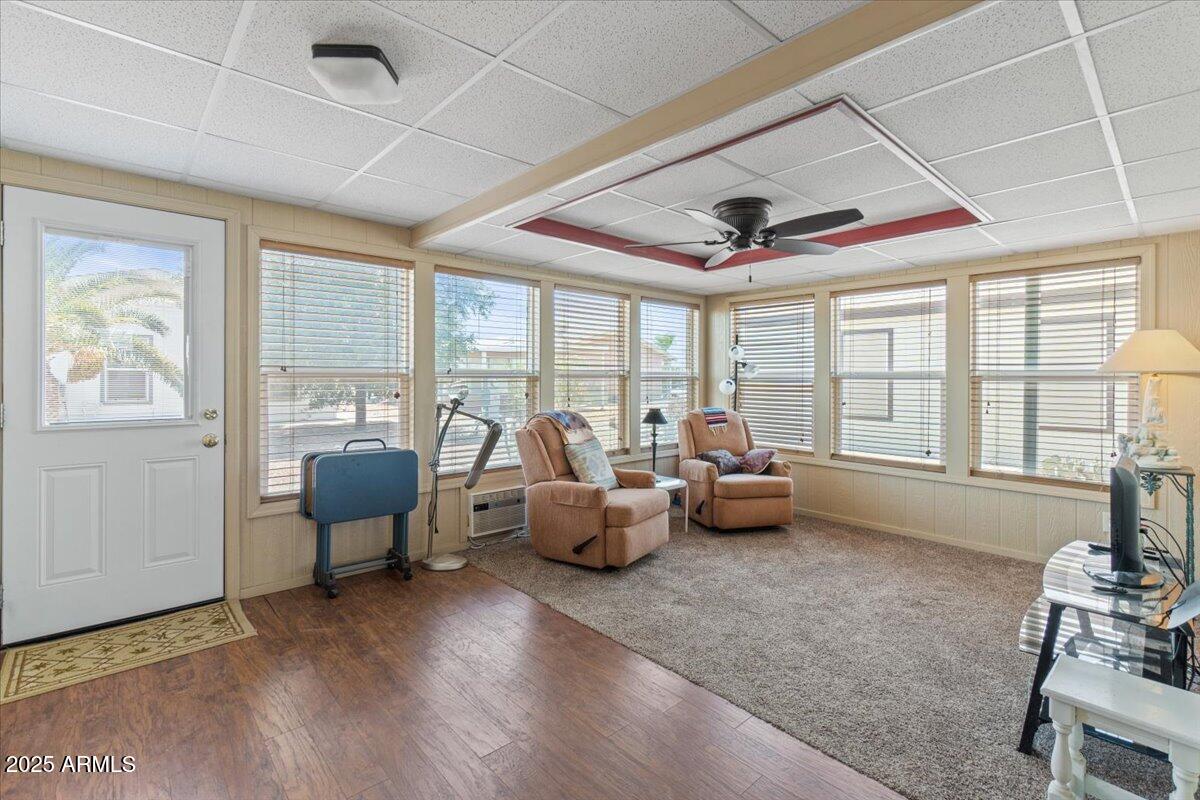 2054 North Thornton Road, Unit 125 Casa Grande, AZ 85122 - Photo 4 of 26 a living room with furniture and floor to ceiling windows