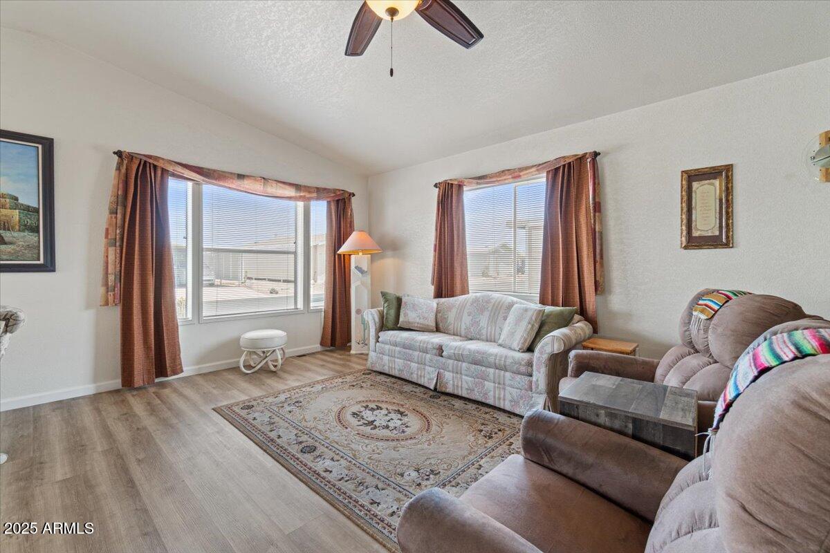 2054 North Thornton Road, Unit 125 Casa Grande, AZ 85122 - Photo 6 of 26 a living room with furniture and a large window