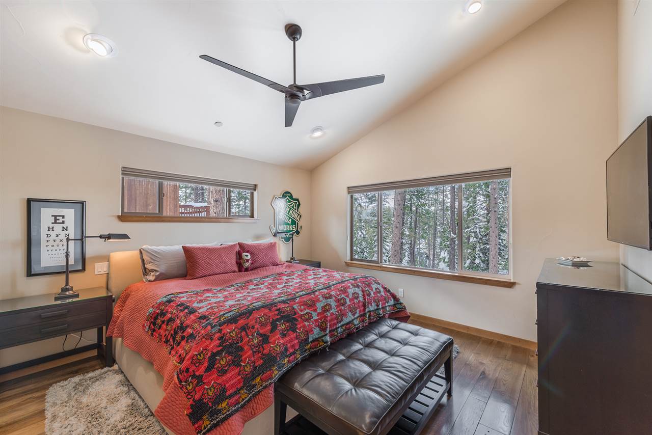 10427 Winter Creek Loop Truckee, CA 96161 - Photo 12 of 21 a bedroom with a large bed and a window