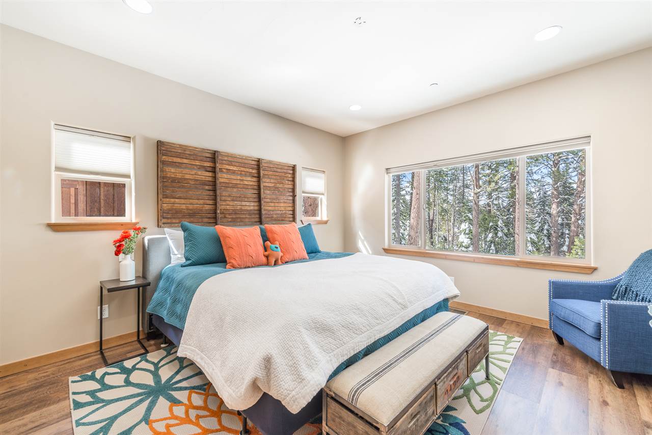 10427 Winter Creek Loop Truckee, CA 96161 - Photo 15 of 21 a bedroom with a bed and wooden floor