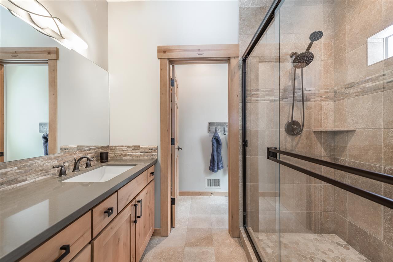 10427 Winter Creek Loop Truckee, CA 96161 - Photo 16 of 21 a bathroom with a double vanity sink and mirror