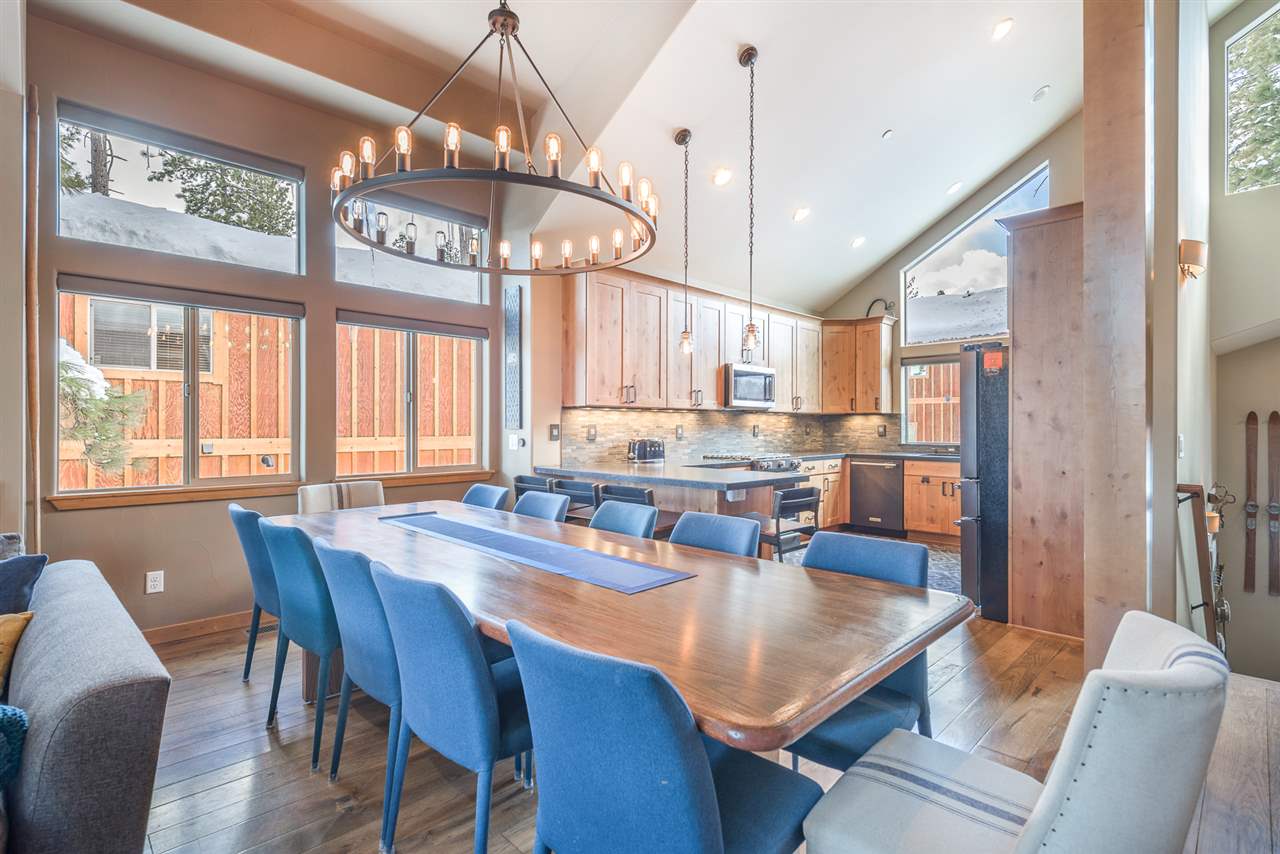 10427 Winter Creek Loop Truckee, CA 96161 - Photo 7 of 21 a dining room with stainless steel appliances kitchen island granite countertop furniture and a large window