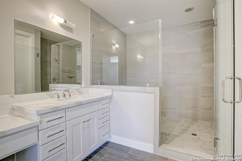 2502 Hadley Street Houston, TX 77003 - Photo 11 of 23 a bathroom with a shower sink and mirror