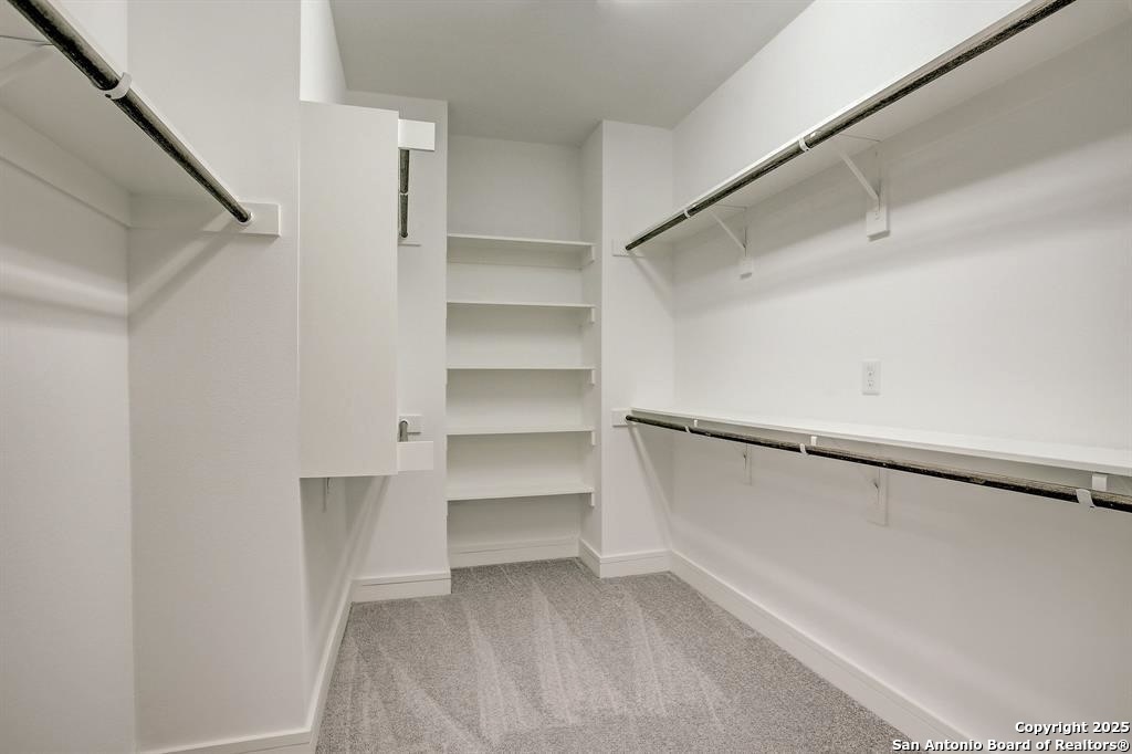 2502 Hadley Street Houston, TX 77003 - Photo 12 of 23 a view of walk in closet with empty racks