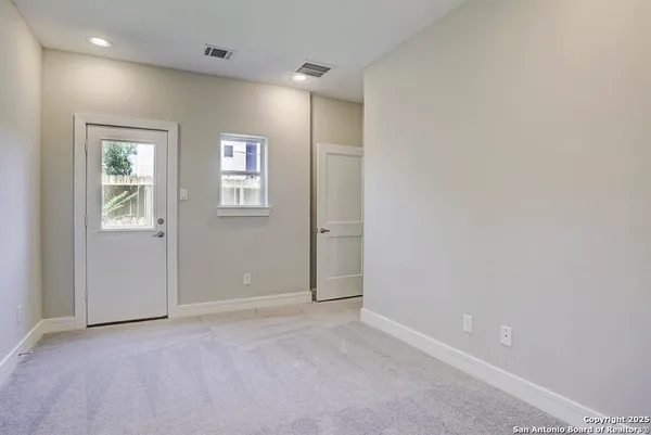 a view of an empty room with a window