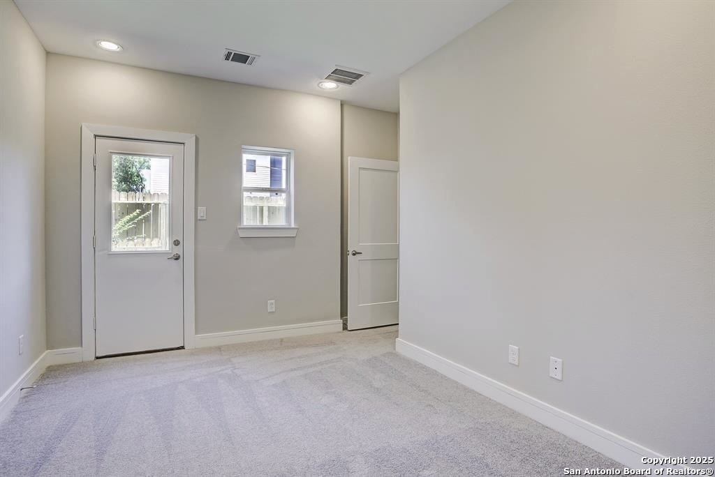 2502 Hadley Street Houston, TX 77003 - Photo 14 of 23 an empty room with windows and closet
