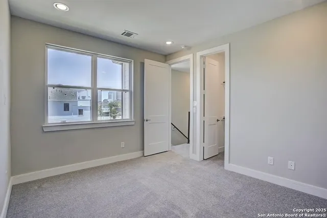 a bathroom with a sink a toilet a mirror a bathtub and shower