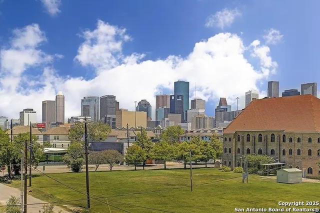 a view of a brick house with a large windows
